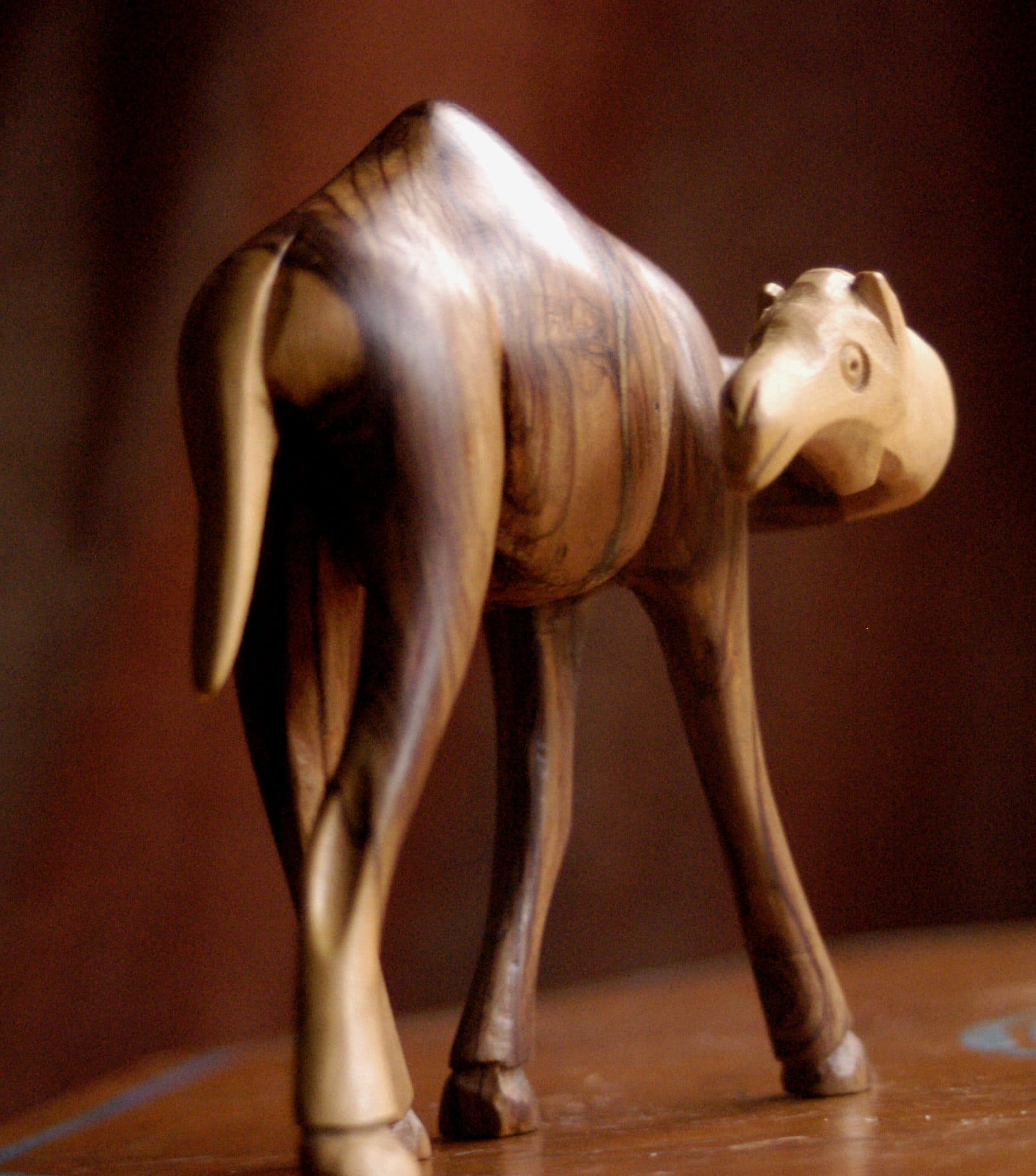 A carved olive-wood camel figurine from Bethlehem, around 1980